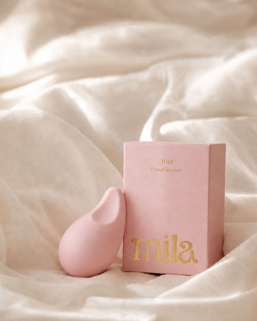 Aura beside its box on white silk
