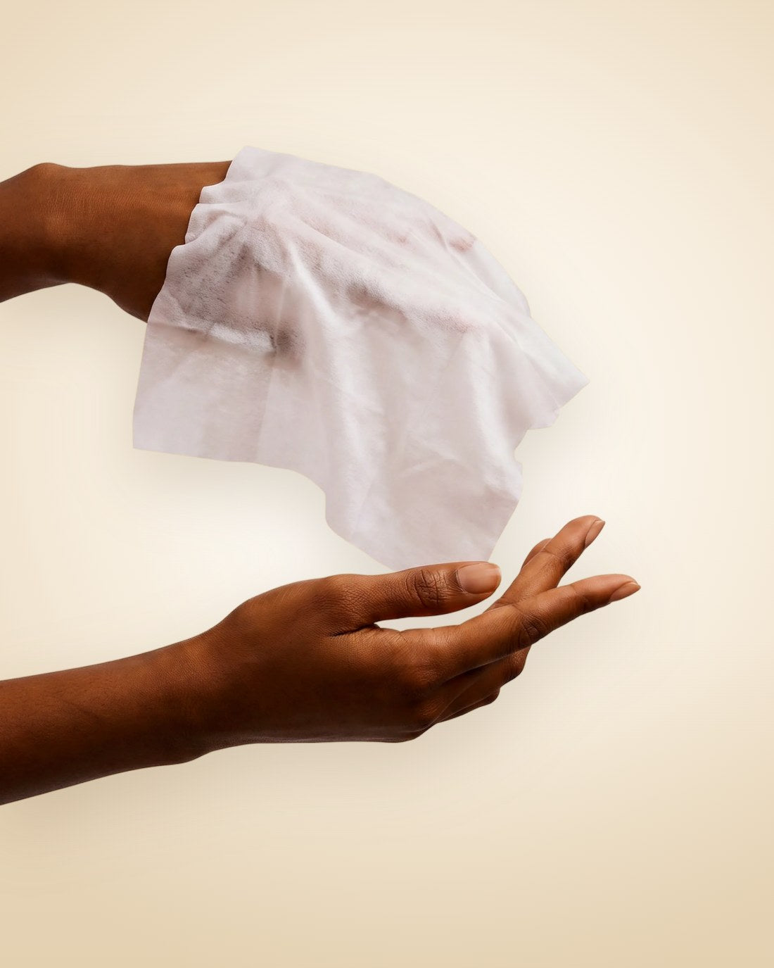 Hands holding a soft Bare wipe